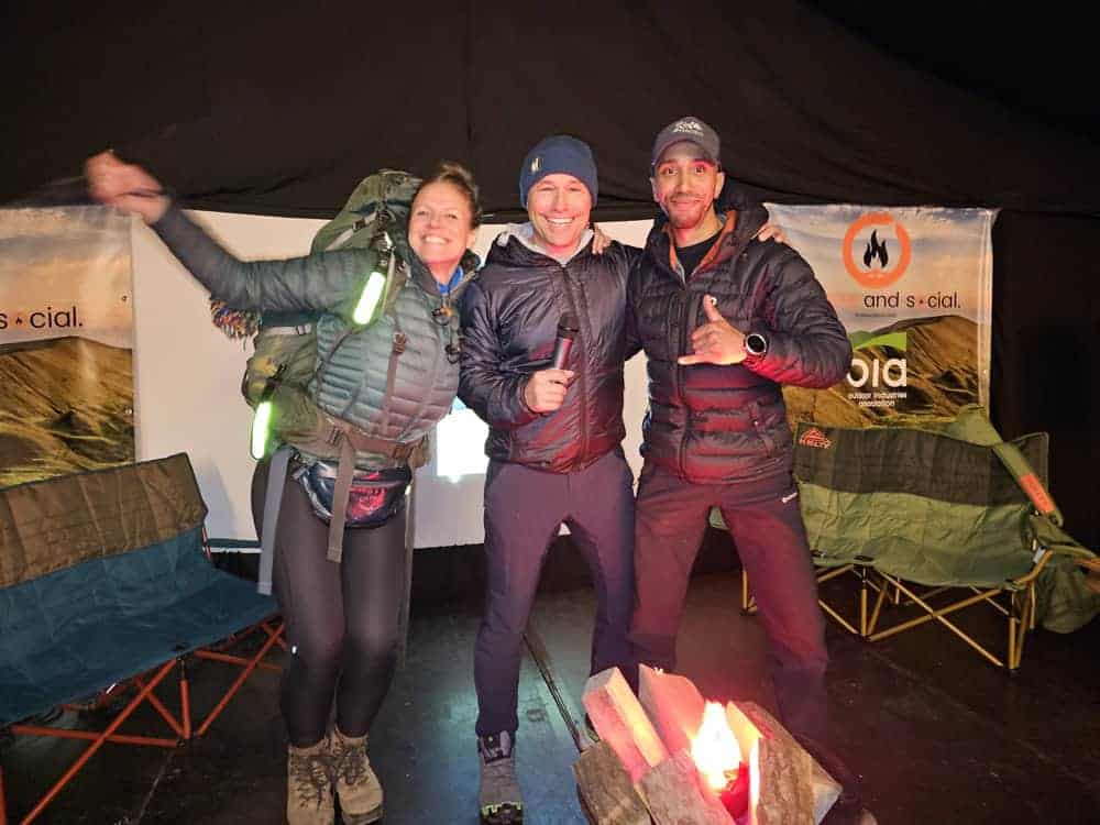 Linzi Bell pictured at Outdoor and Social 2025 with fellow speaker Deon Barrett (right) and host Kev Harris (centre).